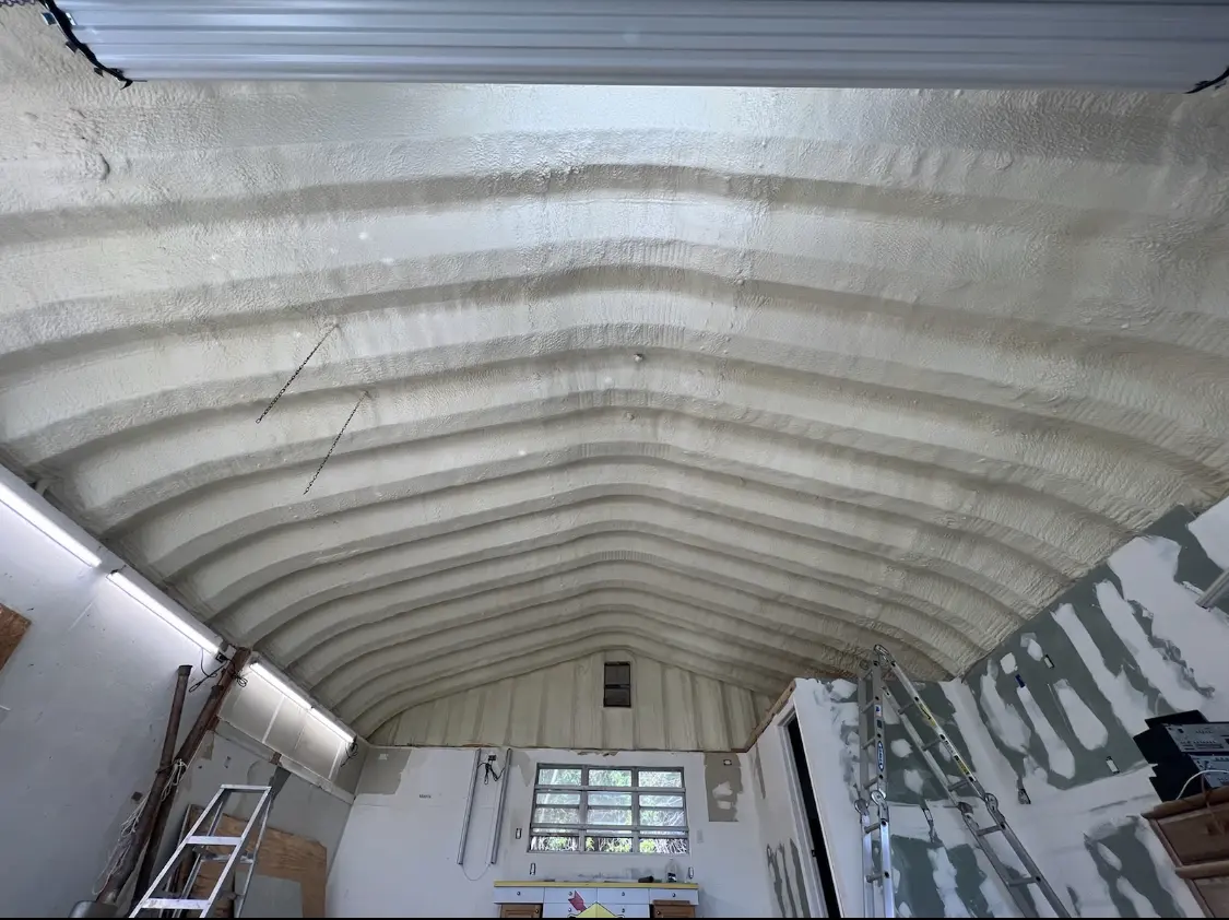 Spray polyurethane foam applied to the underside of a metal roof deck in Millbrook